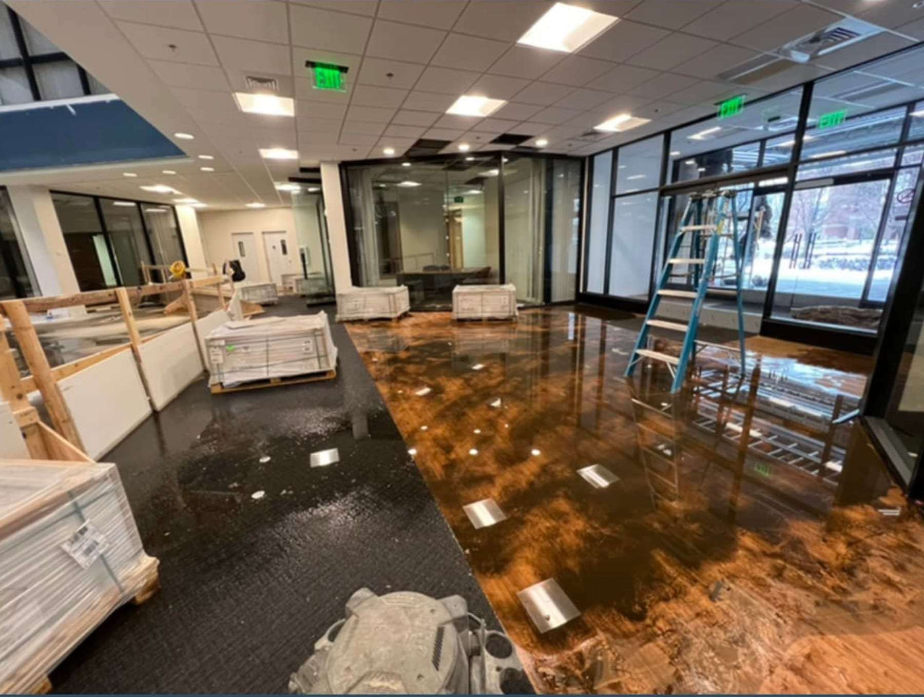 Flooded commercial office floor with standing water during cleanup